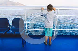 Young boy on a ferry-boat