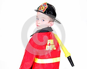 Young boy in fireman costume