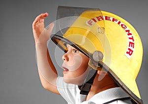 Young boy in Fireman's Helmet