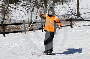 Young boy for first time with cross-country skiing