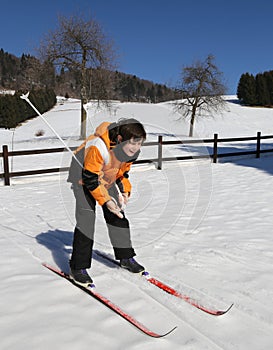 Young boy for first time with cross-country skiing