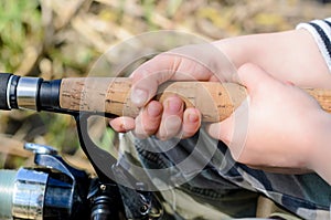 Young boy fishing with a spinning reel