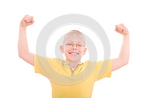 A young boy flexes his muscles