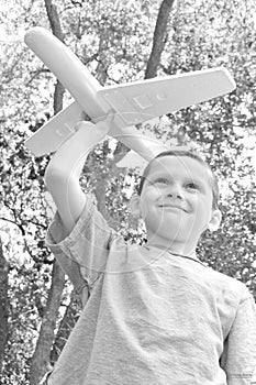 Young boy flying plane