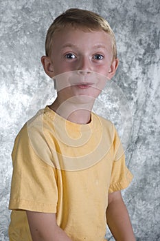 Young boy in front of photo ba