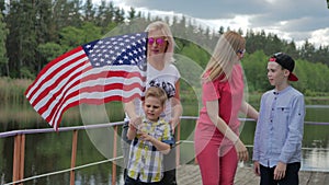 Young boy funny dancing with US flag