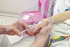 Young boy getting glucose injection