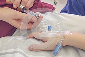 Young boy getting glucose injection