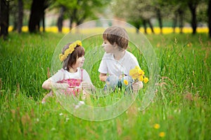 Young boy and girl in grass