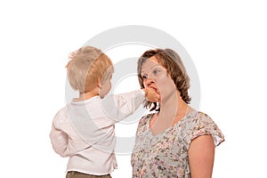 Young boy giving a candy to her mother