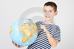 Young boy with globe