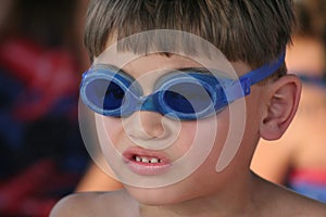 Young boy with goggles to swim