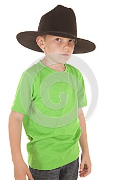 Young boy green shirt cowboy hat serious