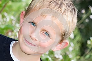 Young Boy Grinning in the Garden