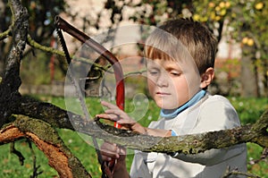 Young boy with handsaw photo