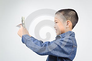 Young boy with happy and smile with bank note