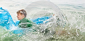 Young boy has fun jumping on an air mattress