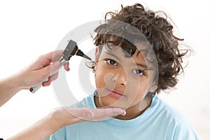 Young boy having ear examination during a visit