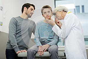 young boy having ears checked