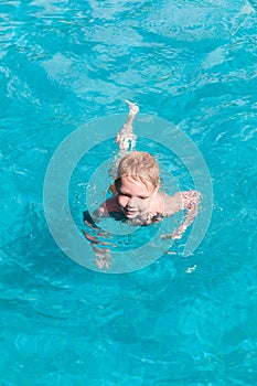 Young boy having fun in swimming pool