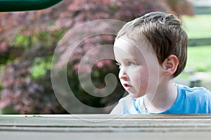 Young boy having fun on a swing set