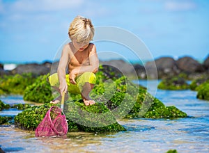 Young boy having fun on tropcial beach