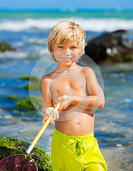 Young boy having fun on tropcial beach