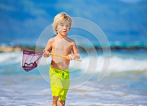 Young boy having fun on tropcial beach