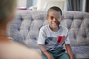 Young boy having therapy with a child psychologist