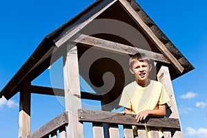 Young boy in a high seat