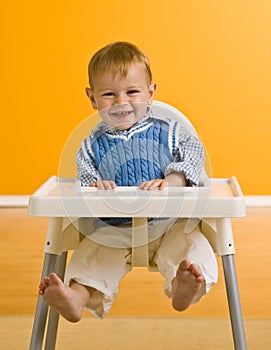 Young boy in highchair