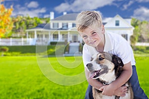 Young Boy and His Dog in Front of House