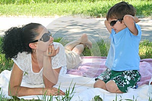 Young boy and his mother enjoying the park