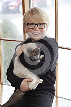 Young boy with his pet cat