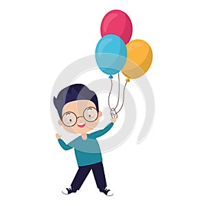 Young boy holding balloons