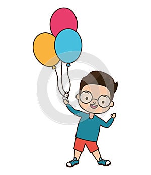 Young boy holding balloons