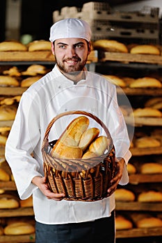 Young boy holding a basket with bakery products