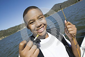 Young Boy Holding Fishing Bait