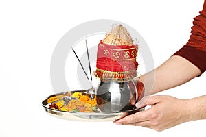 Young boy is holding in hand pooja thali for navratri festival