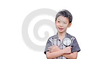 Young boy holding magnifying glass