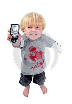 Young boy holding mobile phone showing santa calling