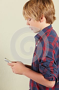 Young Boy Holding Tablet Computer
