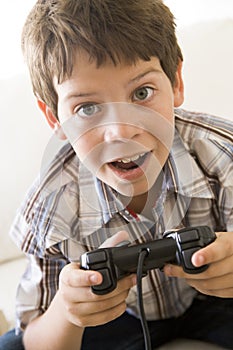 Young boy holding video game controller