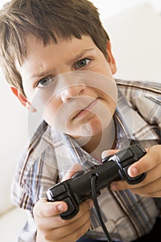 Young boy holding video game controller