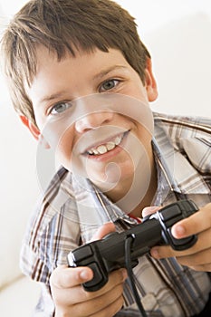 Young boy holding video game controller