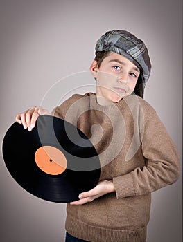 Young boy holding a vinyl record