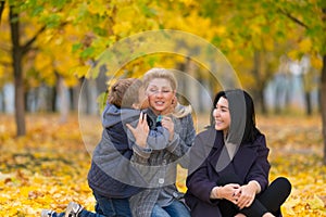 Young boy hugging and kissing his mother.