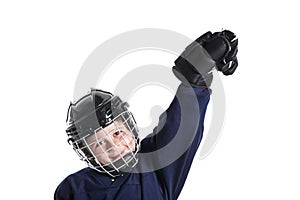 Young boy in ice hockey gear against white photo