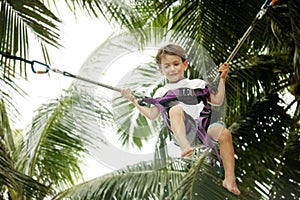 Young boy jumping bungee