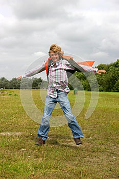 Young boy jumping for joy II